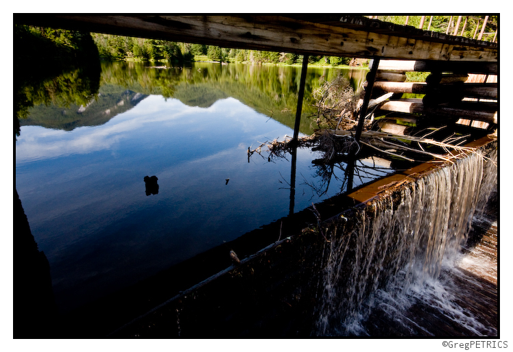 Colden in the reflection behind Marcy Dam