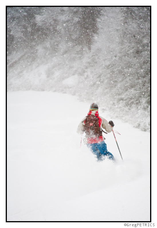 Kristin making some pow turns on the sides