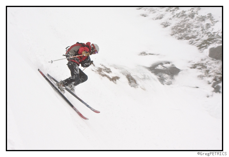 Pete descends with his camera bag visible