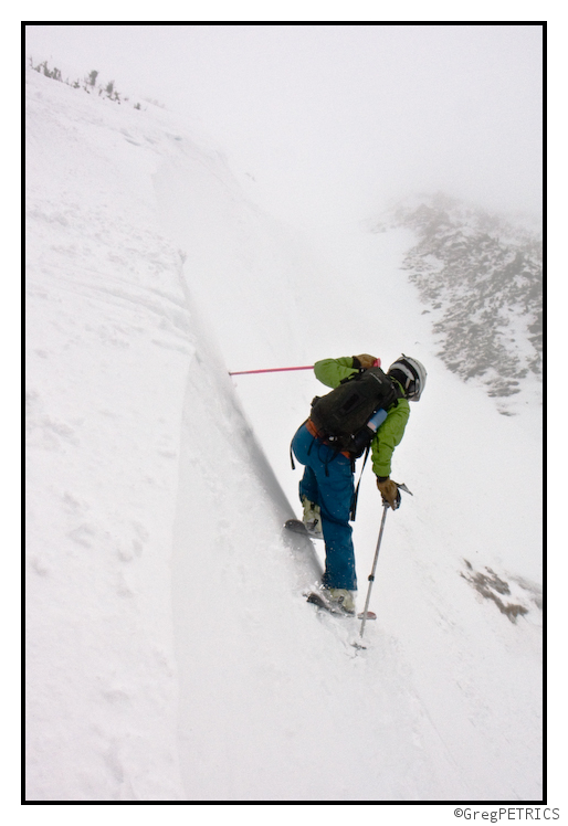 Kristin skis in bright clothes