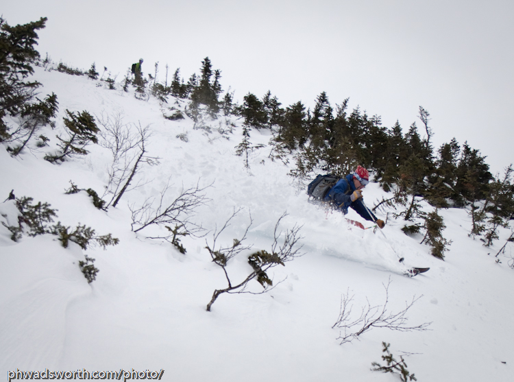 Greg descends a sliver of snow