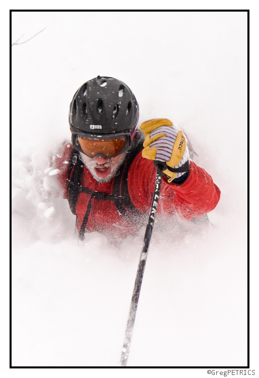 mega closeup of deep powder skiing