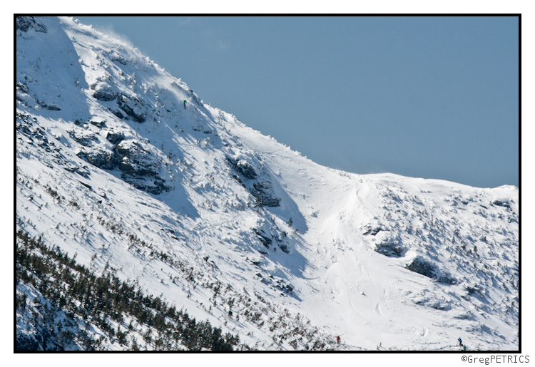 a sight of skiers across the valley