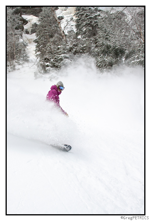 Christian snowboards through powder in VT