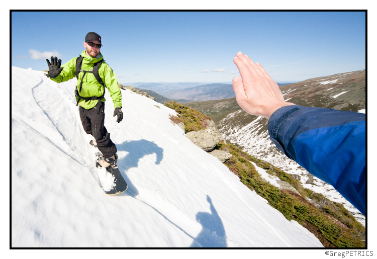 high five on a snowboard