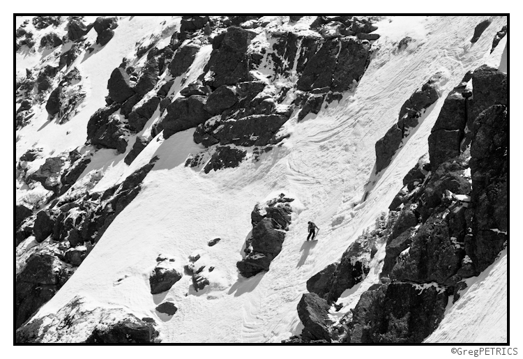 Chris Nelson high fives the snow on a steep slope in New Hampshire